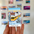aimant frigo train jaune dans la neige